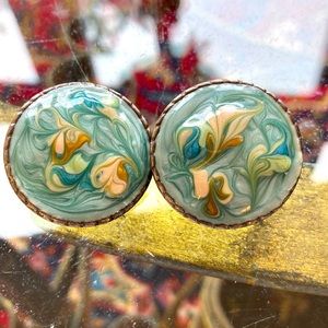 5/$25 Swirled sky blue enameled metal disc pierced earrings. 1980s vintage